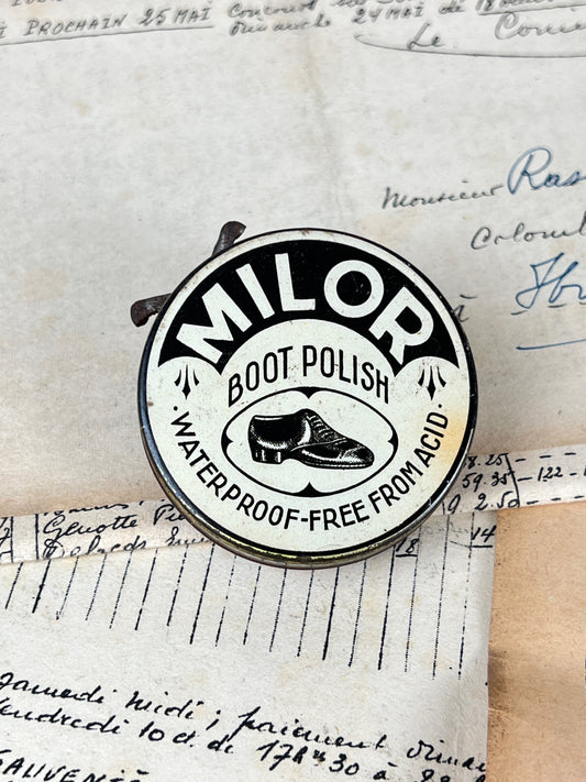 Ancienne boîte de cirage publicitaire en métal de la marque Milor, objet de collection en fer blanc lithographié d'époque vintage.