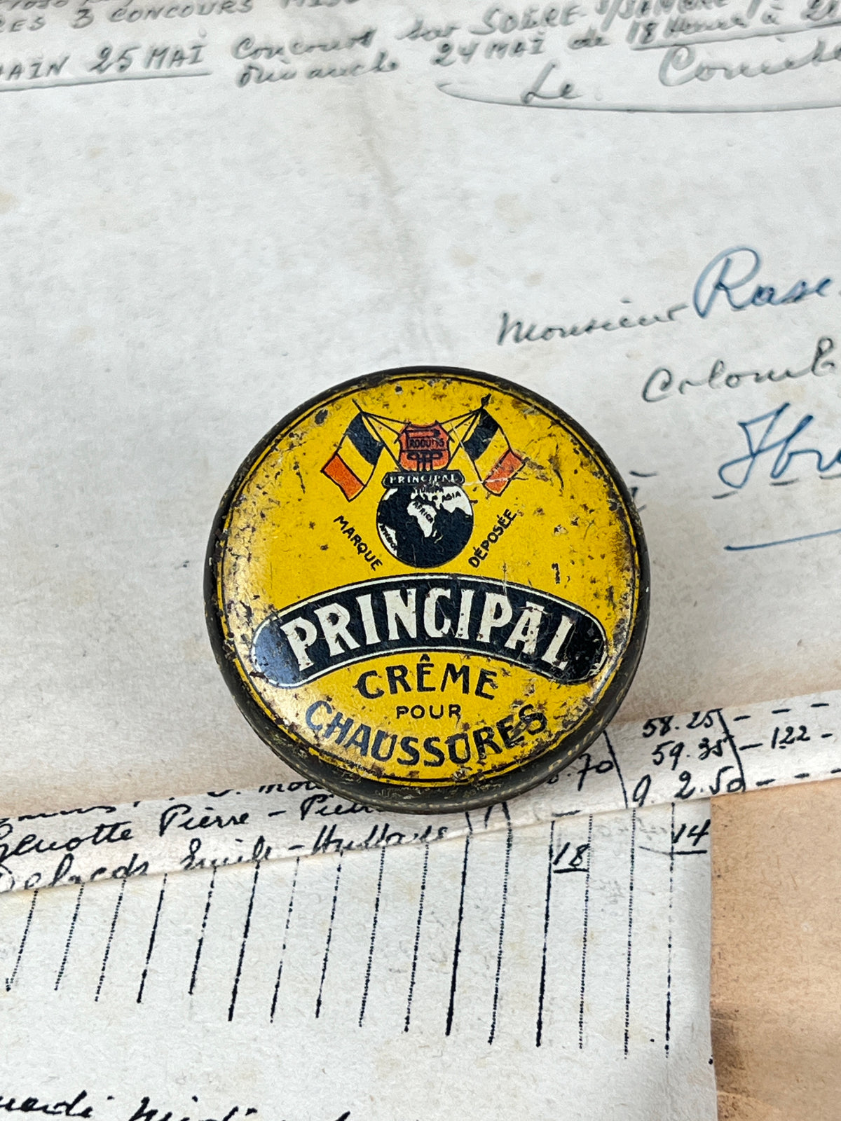 Ancienne boîte de cirage publicitaire en métal de la marque Principal, objet de collection en fer blanc lithographié d'époque vintage.